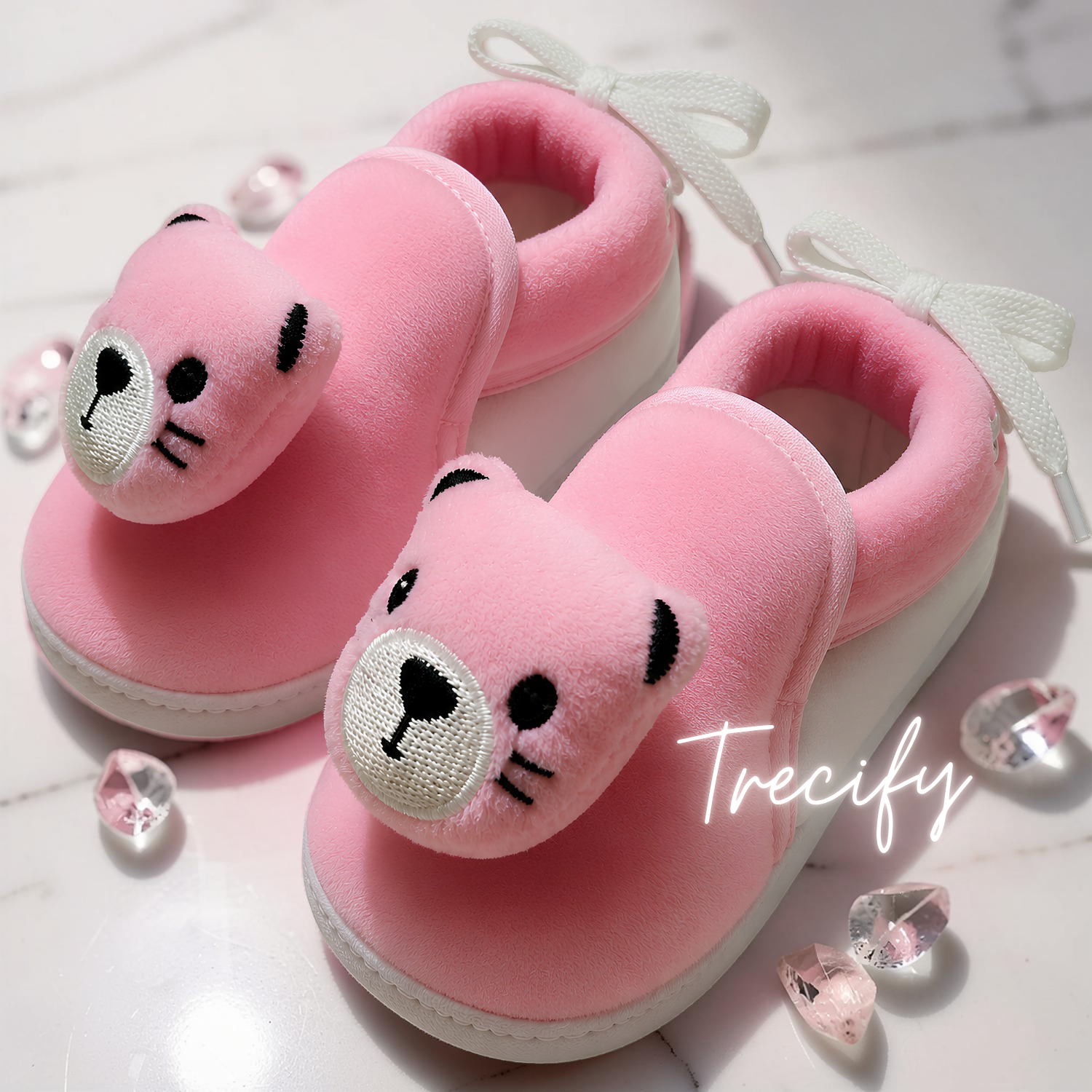 Pink cat-shaped slippers with 'Trecify' branding on a light background
